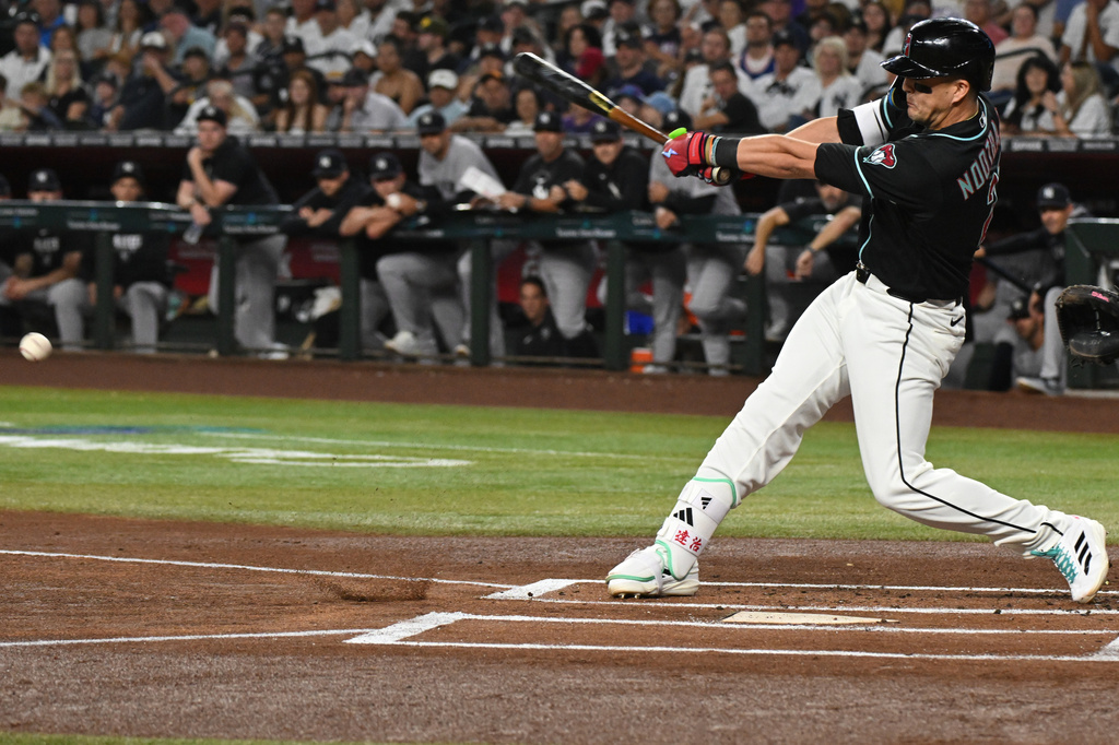 Arizona Diamondbacks' Lars Nootbaar hits during the first inning of a baseball game against the New York Yankees, Saturday, Sept. 19, 2026, in Phoenix. (AP Photo/Caitlin O'Hara)