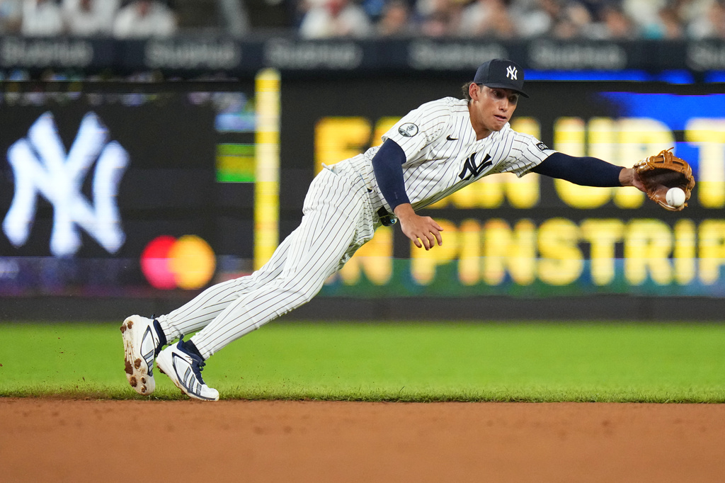 New York Yankees' George Lombard Jr. dives for a ball hit by St. Louis Cardinals' JJ Wetherholt during the third inning of a baseball game Wednesday, Aug. 5, 2026, in New York. (AP Photo/Frank Franklin II)