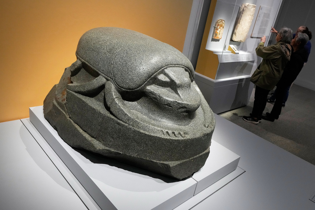 A monumental scarab is displayed in the Divine Egypt exhibition, at the Metropolitan Museum of Art, in New York, Tuesday, Oct. 14, 2025. (AP Photo/Richard Drew)