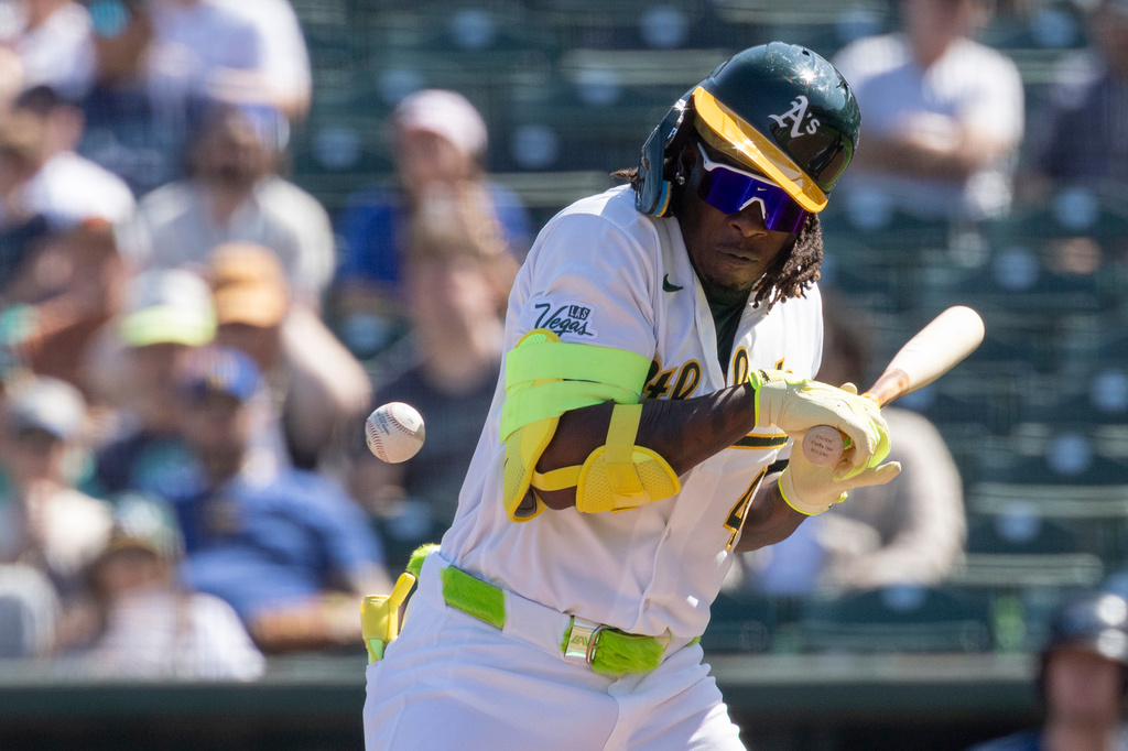 Athletics' Lawrence Butler reacts after being hit by a pitch while at-bat during the third inning of a baseball game against the Seattle Mariners, Sunday, Sept. 13, 2026, in West Sacramento, Calif. (AP Photo/Sara Nevis)