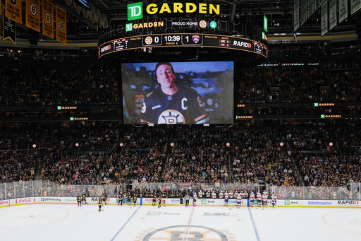 Florida Panthers left wing Brad Marchand (63), who played for more than 15 seasons with the Boston Bruins, is honored with a standing ovation during a break in the first period of an NHL hockey game, Tuesday, Oct. 21, 2025, in Boston. (AP Photo/Charles Krupa) Florida Panthers left wing Brad Marchand (63), who played for more than 15 seasons with the Boston Bruins, is honored with a standing ovation during a break in the first period of an NHL hockey game, Tuesday, Oct. 21, 2025, in Boston. (AP Photo/Charles Krupa)