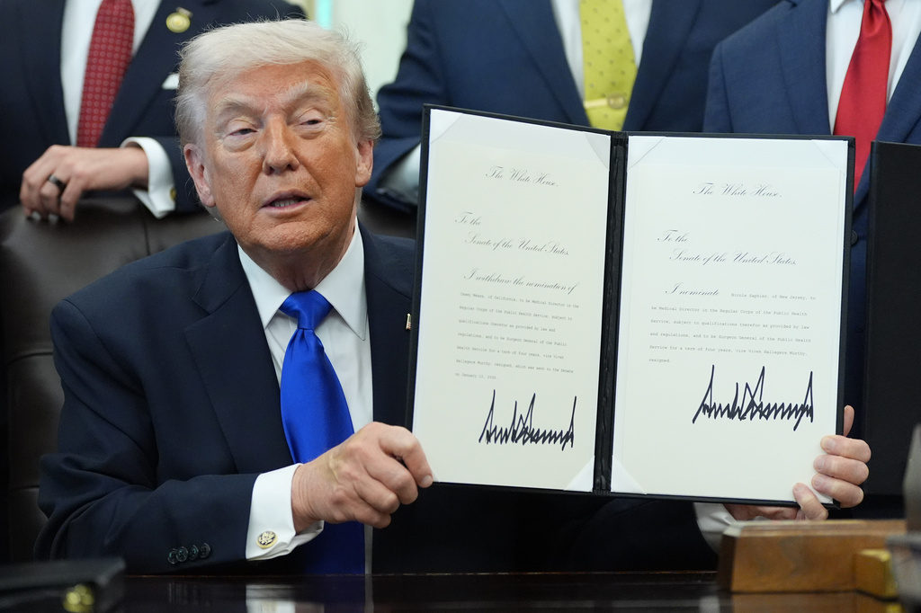 President Donald Trump signs documents regarding the withdrawal of the current nomination and nomination of a new surgeon general in the Oval Office of the White House, Thursday, April 30, 2026, in Washington. (AP Photo/Alex Brandon)