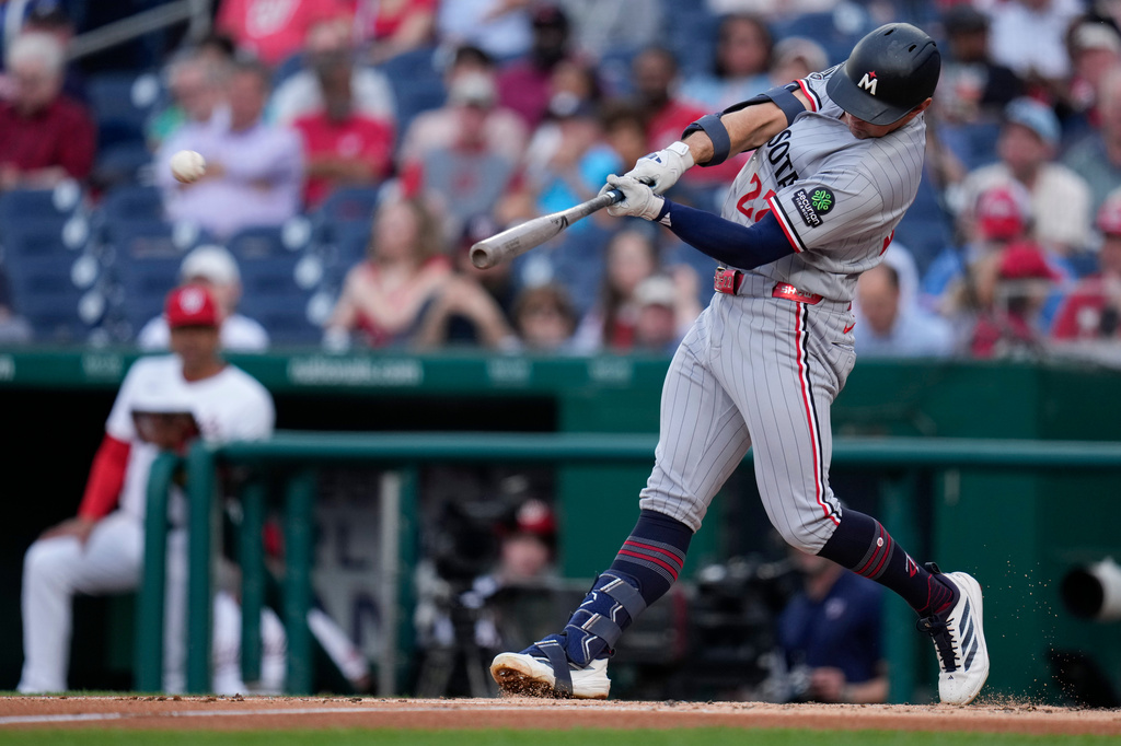 Minnesota Twins' Brooks Lee hits a two RBI double during the second inning of a baseball game against the Washington Nationals, Tuesday, May 5, 2026, in Washington. (AP Photo/Jess Rapfogel)