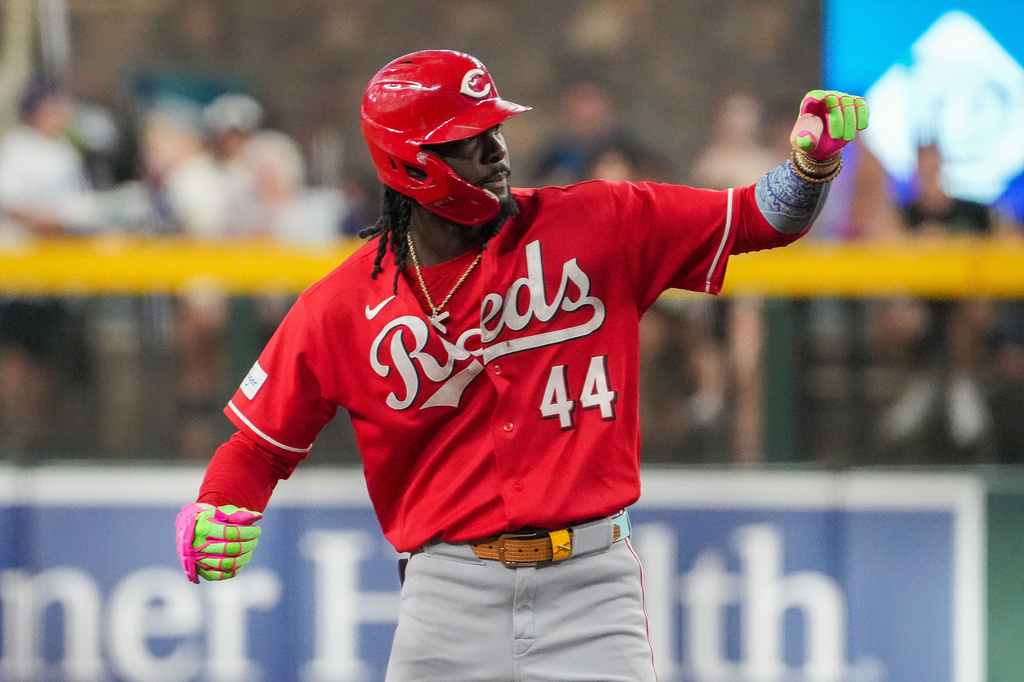 Cincinnati Reds' Elly De La Cruz gestures towards his dugout after hitting a double against the Arizona Diamondbacks during the first inning of a baseball game, Saturday, Aug. 22, 2026, in Phoenix. (AP Photo/Darryl Webb)