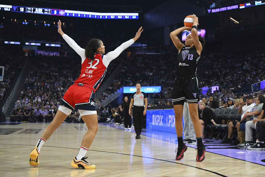 Golden State Valkyrie's Janelle Salaun (13) shoots past Washington Mystics' Alysha Clark (32) in the first quarter of a WNBA basketball game at Chase Center in San Francisco, Saturday, Aug. 30, 2025. (Jose Carlos Fajardo/Bay Area News Group via AP)