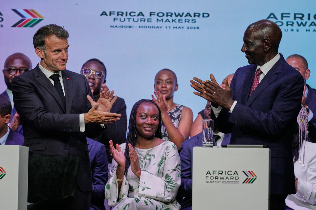 France's President Emmanuel Macron, left, and Kenya's President William Ruto, right, participate in the youth session "Africa Forward, Creation in Motion" during the Africa Forward Summit at the University of Nairobi, Kenya, Monday, May 11, 2026. (AP Photo/Brian Inganga)