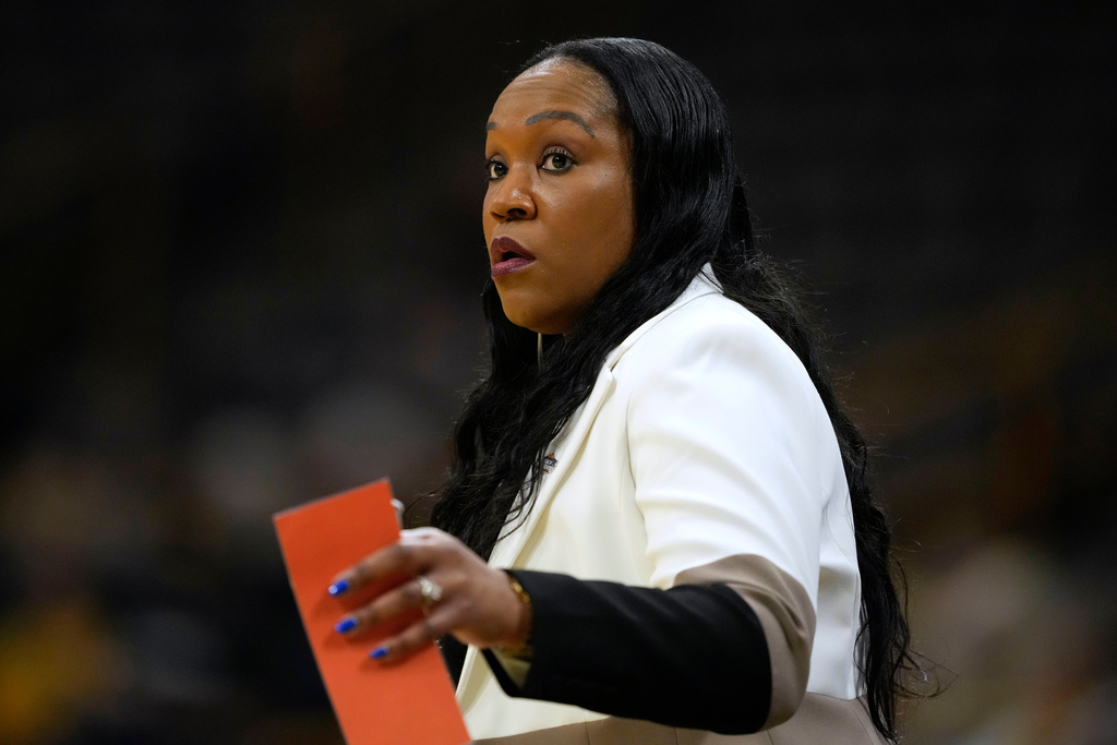 Virginia head coach Amaka Agugua-Hamilton watches from the sideline during the first half against Georgia in the first round of the NCAA college basketball tournament, Saturday, March 21, 2026, in Iowa City, Iowa. (AP Photo/Charlie Neibergall)