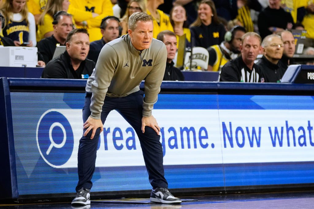 Michigan head coach Dusty May reacts on the sideline during the first half of an NCAA college basketball game against Oakland, Monday, Nov. 3, 2025, in Ann Arbor, Mich. (AP Photo/Ryan Sun)
