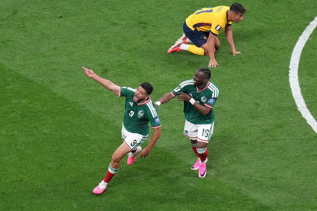 Mexico's Raul Jimenez (9) celebrates with Julian Quinones (16) after scoring their second goal during the World Cup round of 32 soccer match between Mexico and Ecuador in Mexico City, Tuesday, June 30, 2026. (AP Photo/Silvia Izquierdo)