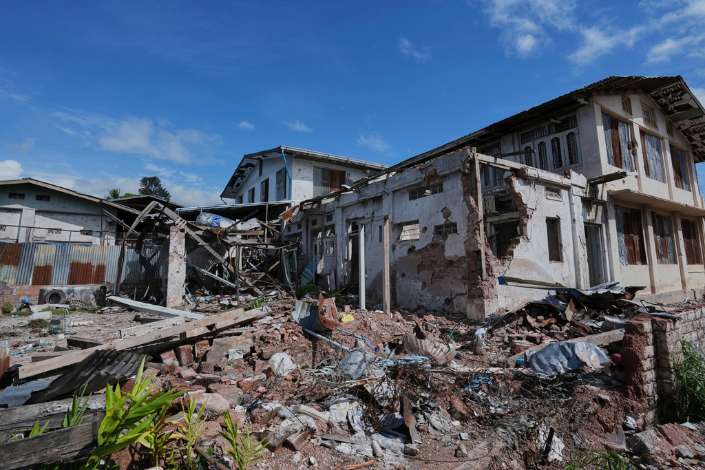 In this photo taken during a trip organised by pro-military Myanmar media, a damaged residence is seen in Kyaukme, northern Shan State, Myanmar, Friday, Oct. 10, 2025. (AP Photo/Aung Shine Oo)