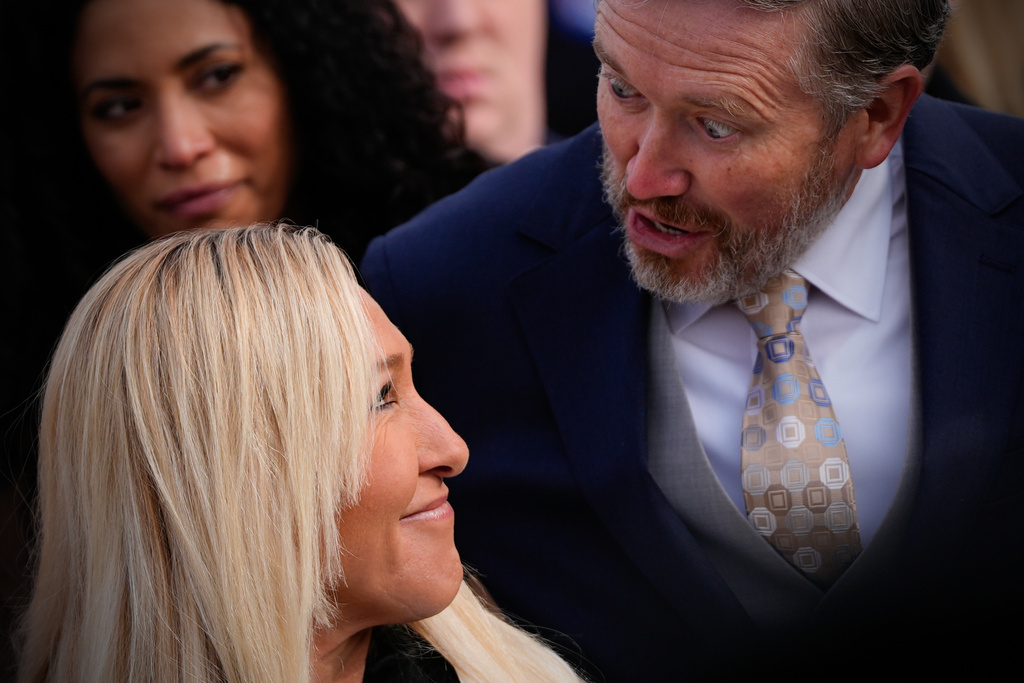 Rep. Marjorie Taylor Greene, R-Ga., and Rep. Thomas Massie, R-Ky., speak to each other during a news conference on the Epstein Files Transparency Act, Tuesday, Nov. 18, 2025, outside the U.S. Capitol in Washington. (AP Photo/Julia Demaree Nikhinson)