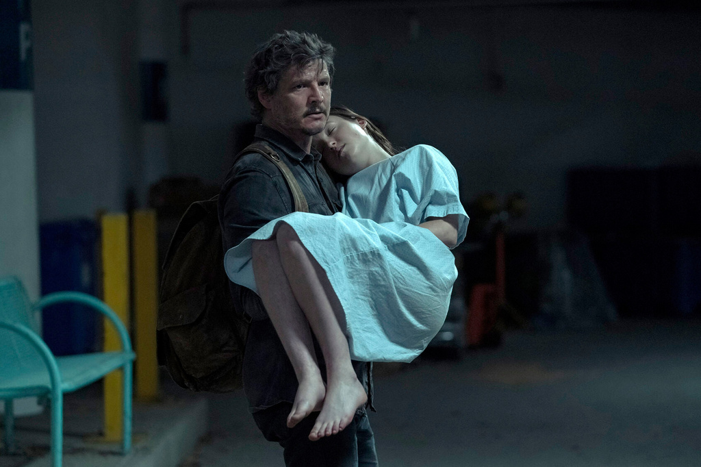 This image released by HBO shows Pedro Pascal, left, and Bella Ramsey in a scene from the series "The Last of Us." (HBO via AP)