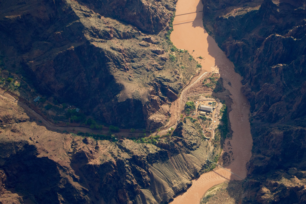 Bright Angel Canyon, damaged by flash floods, runs into the Colorado River in the Grand Canyon, Monday, Aug. 31, 2026, at Grand Canyon National Park, Ariz. (AP Photo/John Locher)