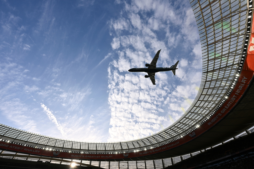 A jetliner flies over the stadium ahead of a second test rugby match between South Africa and New Zealand, in Cape Town, South Africa, Saturday, Aug. 29, 2026. (AP Photo)