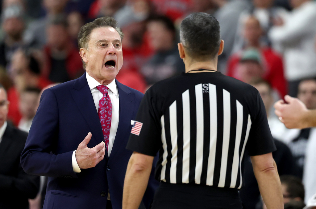 St. John's head coach Rick Pitino disputes a foul with a game official during the second half of an NCAA college basketball game against Providence, Saturday, Feb. 14, 2026, in Providence, R.I. (AP Photo/Mark Stockwell)