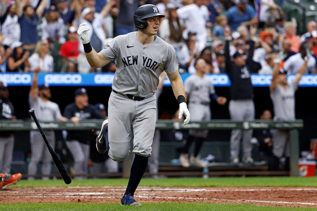 New York Yankees' Ben Rice watches his grand slam during the 10th inning of a baseball game against the Baltimore Orioles, Sunday, Sept. 21, 2025, in Baltimore. (AP Photo/Peter Casey)
