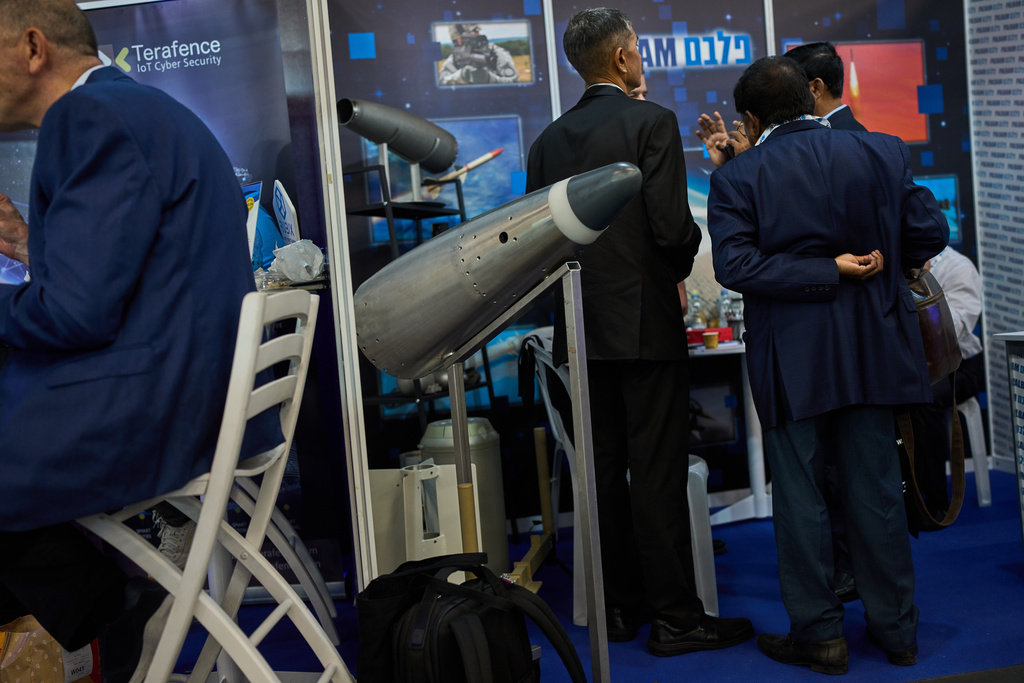 Visitors attend a defense industry exhibition in Tel Aviv, Israel, Tuesday, Feb. 17, 2026. (AP Photo/Oded Balilty)