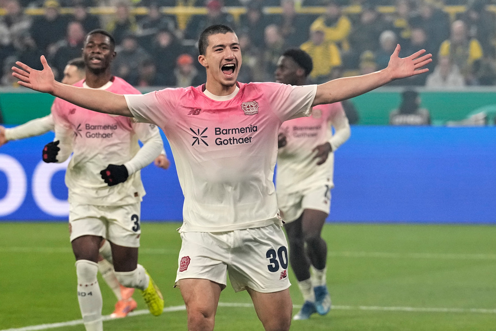 Leverkusen's Ibrahim Maza celebrates after scoring the opening goal during the German Soccer Cup round of sixteen soccer match between Borussia Dortmund and Bayer 04 Leverkusen in Dortmund, Germany, Tuesday, Dec. 2, 2025. (AP Photo/Martin Meissner)