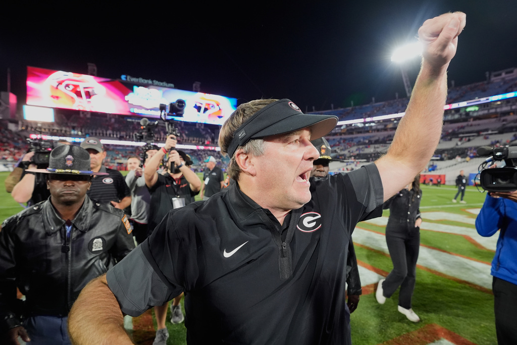 Georgia head coach Kirby Smart celebrates in front of fans as he leaves the field after defeating Florida in an NCAA college football game Saturday, Nov. 1, 2025, in Jacksonville, Fla. (AP Photo/John Raoux)
