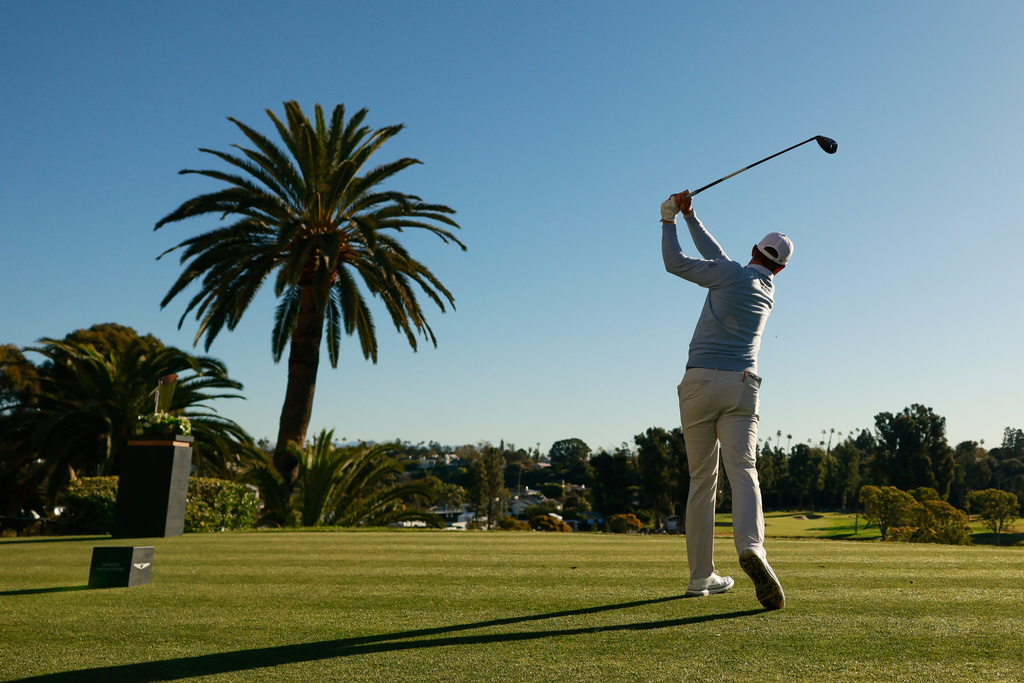 Ben Griffin hits from the first tee during the third round of the Genesis Invitational golf tournament at Riviera Country Club, Saturday, Feb. 21, 2026, in the Pacific Palisades area of Los Angeles. (AP Photo/Caroline Brehman )