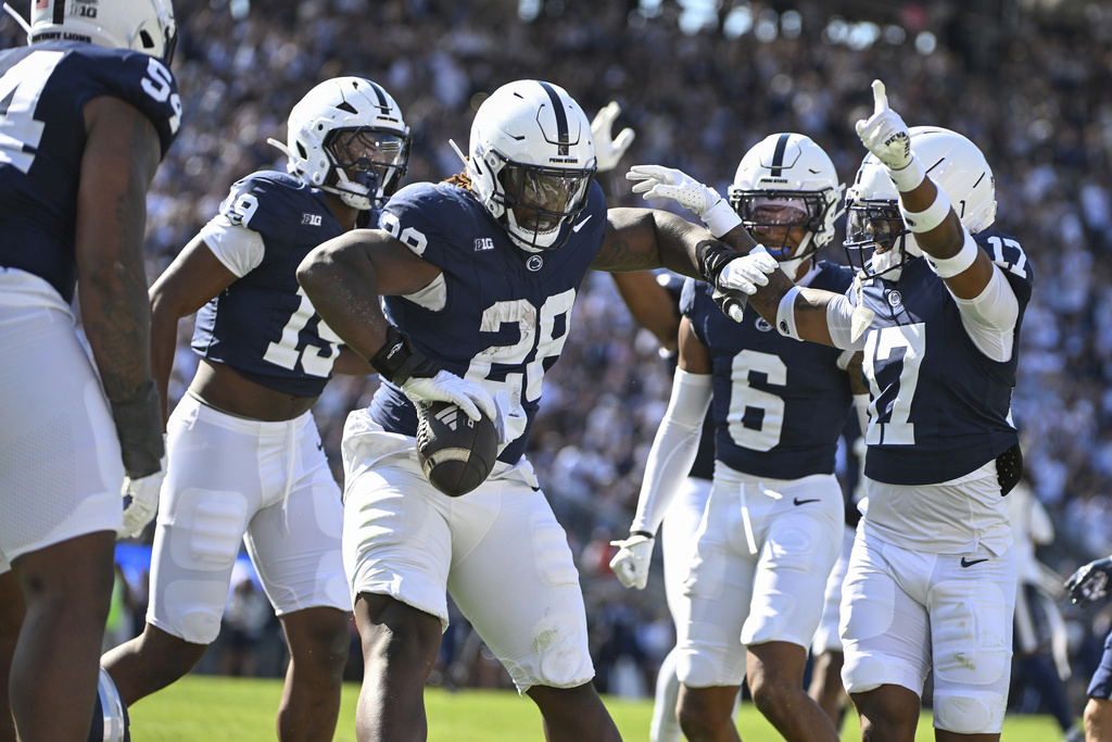 Penn State defensive tackle Zane Durant (28) celebrates an interception against Nevada during the first quarter of an NCAA college football game, Saturday, Aug. 30, 2025, in State College, Pa. (AP Photo/Barry Reeger)