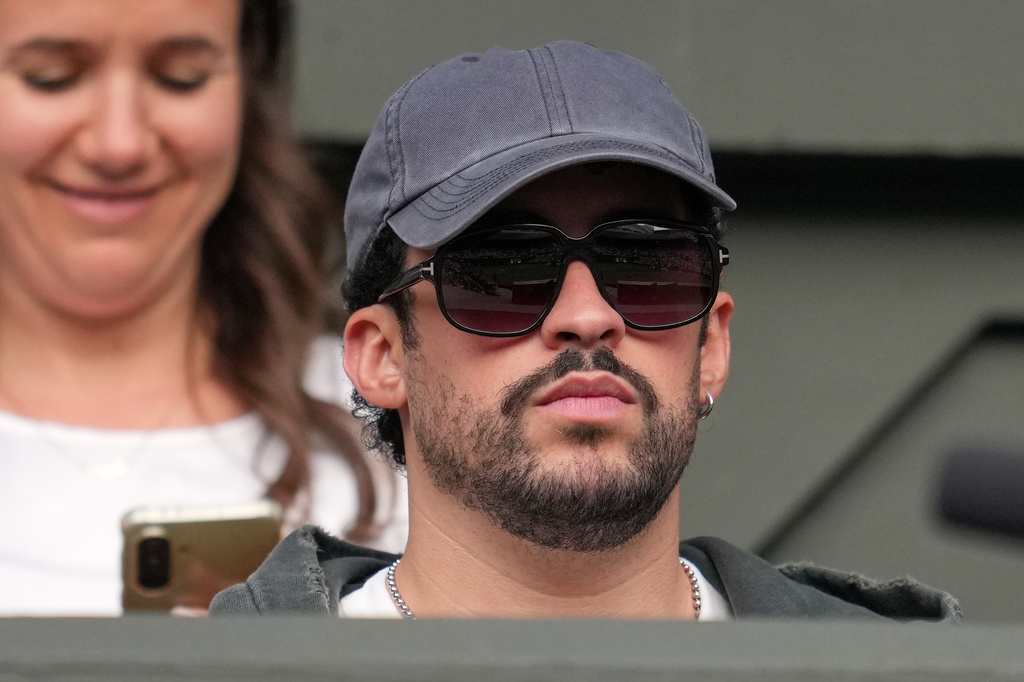 Puerto Rican singer Bad Bunny watches Novak Djokovic of Serbia playing against Yibing Wu of China during the men's singles at the Wimbledon Tennis Championships in London, Monday, June 29, 2026.(AP Photo/Kin Cheung)