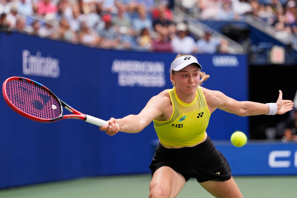 Qinwen Zheng, of China, returns the ball to Elena Rybakina, of Kazakhstan, during the quarterfinal round of the U.S. Open tennis championships, Wednesday, Sept. 9, 2026, in New York. (AP Photo/Seth Wenig)