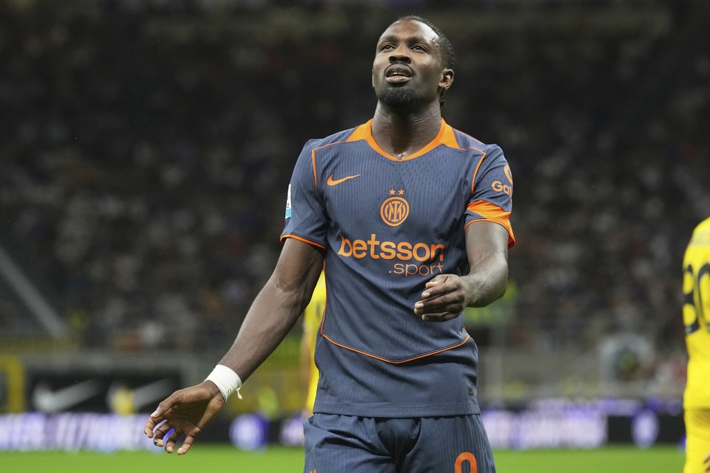 Inter Milan's Marcus Thuram reacts after he missed a scoring chance during a Serie A soccer match between Inter Milan and Sassuolo, at San Siro stadium in Milan, Italy, Sunday, Sept. 21, 2025. (AP Photo/Antonio Calanni)