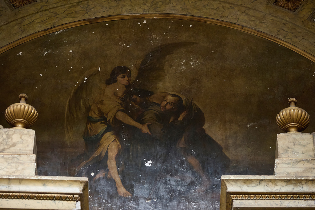 A painting on the altar inside San Juan de Dios church shows repairs due to cracks caused by an earthquake, in Mexico City, Friday, Sept. 19, 2025. The church withstood the 8.0 earthquake of 1985, however, its structure was severely damaged in 2017 and it was forced to shut down and reopened in late 2024 after most of its restoration was completed. (AP Photo/Ginnette Riquelme)