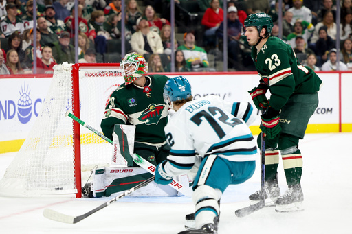 San Jose Sharks left wing William Eklund (72) scores against Minnesota Wild goaltender Jesper Wallstedt, left, while Wild center Marco Rossi (23) looks on during the second period of an NHL hockey game, Sunday, Oct. 26, 2025, in St. Paul, Minn. (AP Photo/Ellen Schmidt) San Jose Sharks left wing William Eklund (72) scores against Minnesota Wild goaltender Jesper Wallstedt, left, while Wild center Marco Rossi (23) looks on during the second period of an NHL hockey game, Sunday, Oct. 26, 2025, in St. Paul, Minn. (AP Photo/Ellen Schmidt)