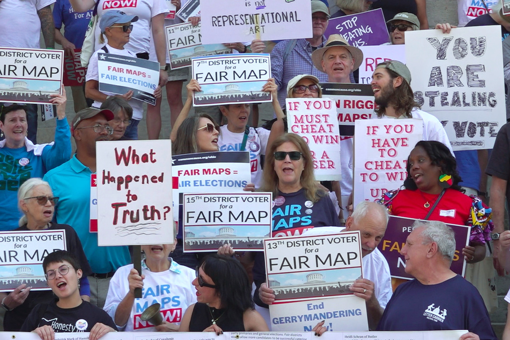 This photo taken from video shows organizers rallying outside of the Ohio Statehouse to protest gerrymandering and advocate for lawmakers to draw fair maps on Wednesday, Sept. 17, 2025, in Columbus, Ohio. (AP Photo/Patrick Aftoora-Orsagos)