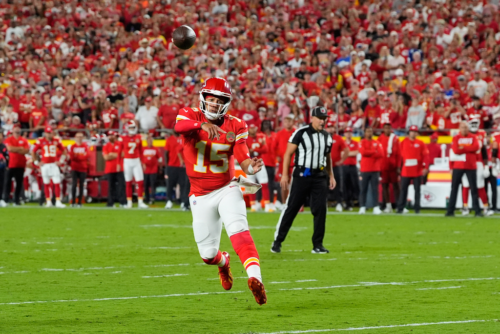 Kansas City Chiefs quarterback Patrick Mahomes throws a touchdown pass to wide receiver Xavier Worthy during the first half of an NFL football game against the Indianapolis Colts Sunday, Sept. 20, 2026, in Kansas City, Mo. (AP Photo/Charlie Riedel)