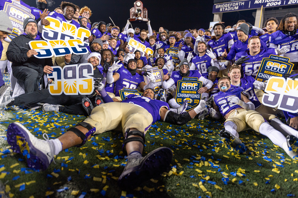 James Madison team celebrates after winning the Sun Belt championship NCAA college football game against Troy, Friday, Dec. 5, 2025, in Harrisonburg, Va. (AP Photo/Robert Simmons)