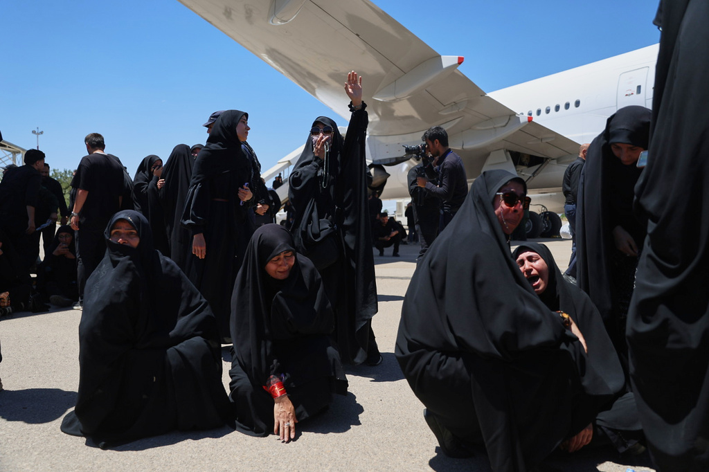 Women react as the coffin of the late Iranian Supreme Leader Ayatollah Ali Khamenei arrives at Hasheminejad International Airport from Iraq for the final stage of his dayslong funeral ceremonies in Mashhad, northeastern Iran, Thursday, July 9, 2026. (Mohammad Hasan Salavati/Shahraranews via AP)