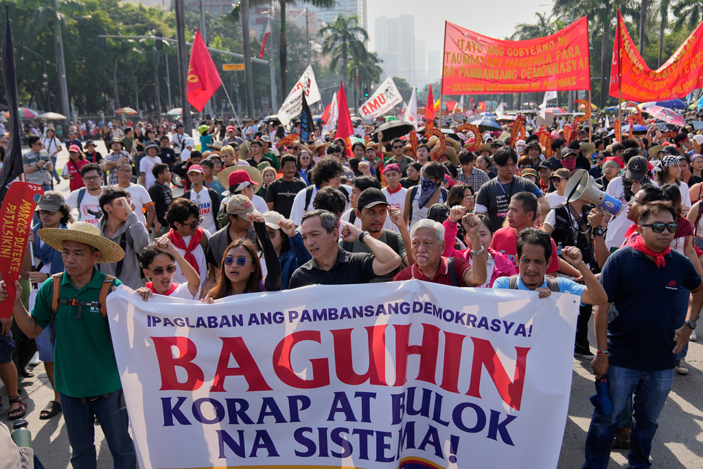 Protesters shout slogans during anti-corruption protest in Manila, Philippines on Sunday Nov. 30, 2025. (AP Photo/Aaron Favila)