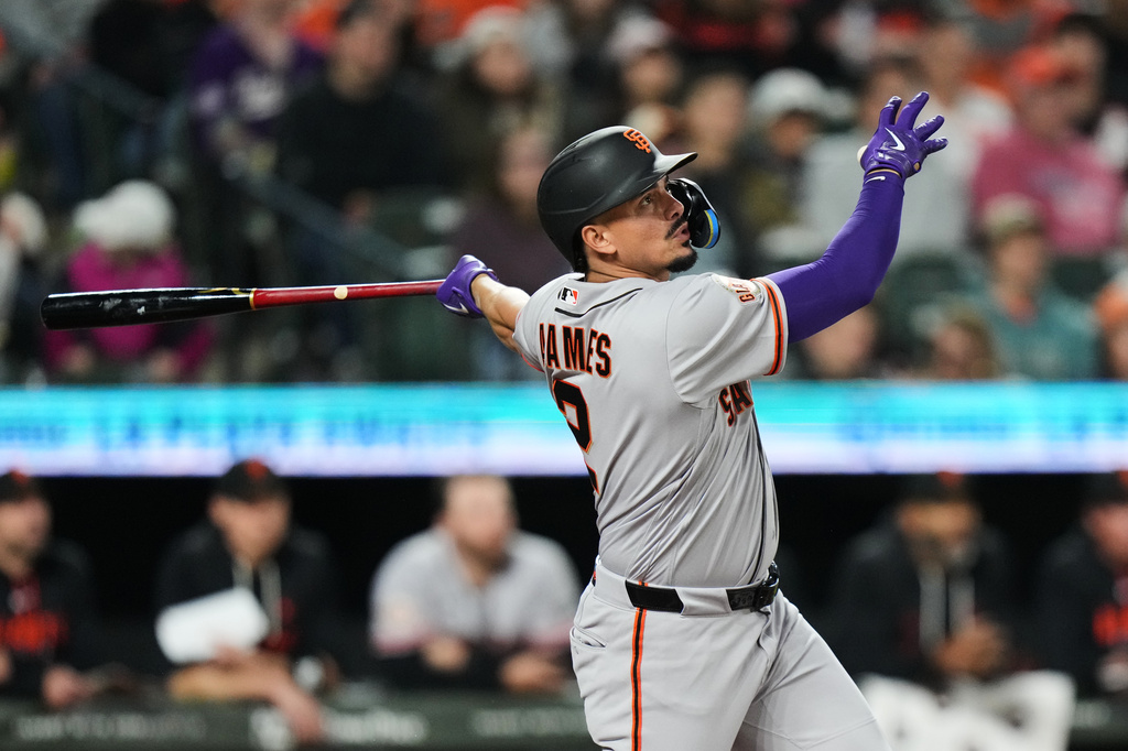 San Francisco Giants' Willy Adames follows through on a home run during the third inning of a baseball game against the Baltimore Orioles, Friday, April 10, 2026, in Baltimore. (AP Photo/Stephanie Scarbrough)