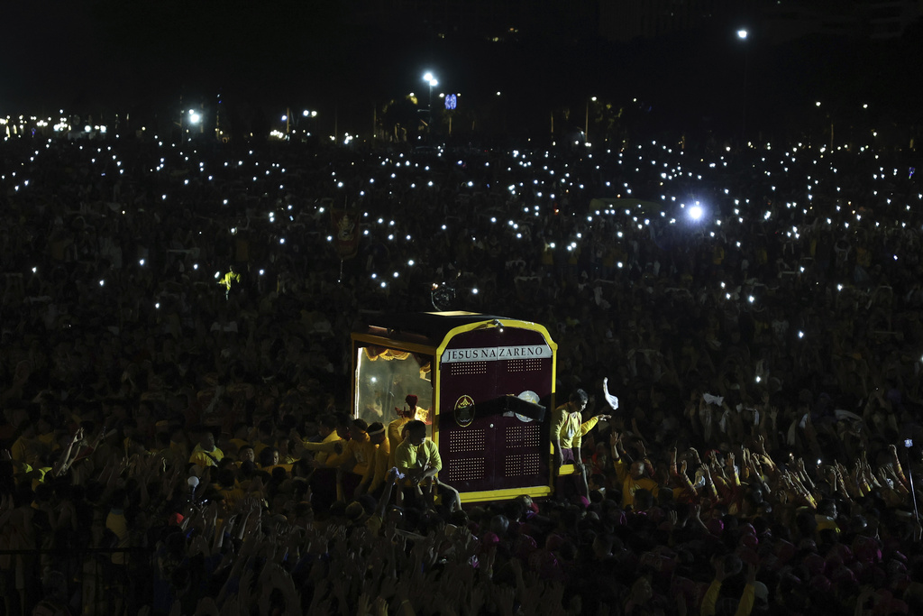 Devotees pull a glass-covered carriage carrying the image of Jesus Nazareno during its annual procession in Manila, Philippines, Thursday. Jan. 9, 2025. (AP Photo/Basilio Sepe)
