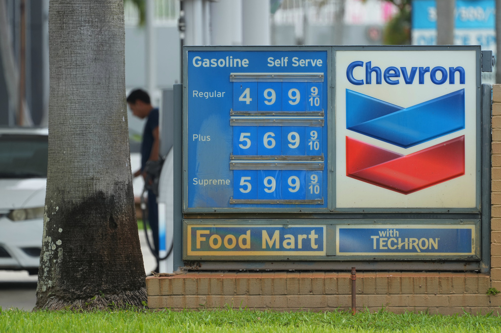 FILE - A customer pumps gas at a Chevron station Wednesday, May 27, 2026, in North Miami, Fla.(AP Photo/Marta Lavandier, File)