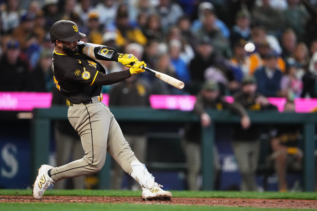 San Diego Padres' Rodolfo Durán hits a two-run home run against the Seattle Mariners during the seventh inning of a baseball game, Saturday, May 16, 2026, in Seattle. (AP Photo/Lindsey Wasson)