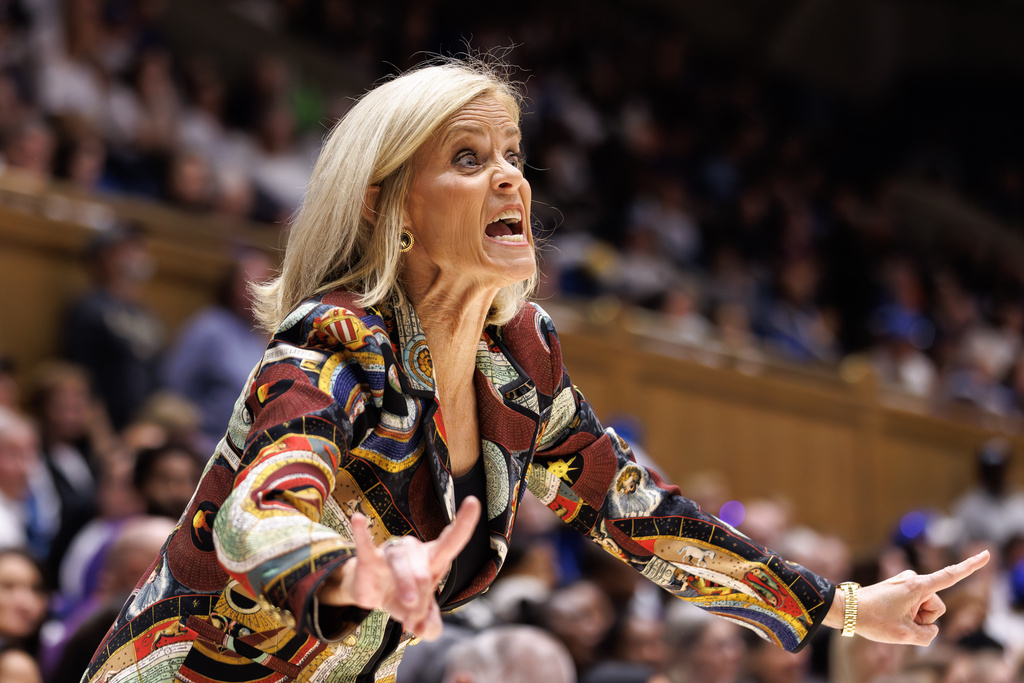 LSU head coach Kim Mulkey shouts toward the court during the first half of an NCAA college basketball game against Duke in Durham, N.C., Thursday, Dec. 4, 2025. (AP Photo/Ben McKeown)