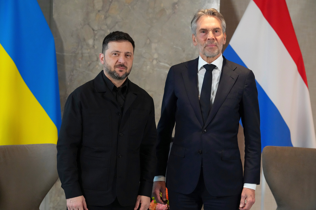 Dutch Prime Minister Dick Schoof, right, poses with Ukraine's President Volodymyr Zelenskyy in The Hague, Netherlands, Tuesday, Dec. 16, 2025. (AP Photo/Peter Dejong)
