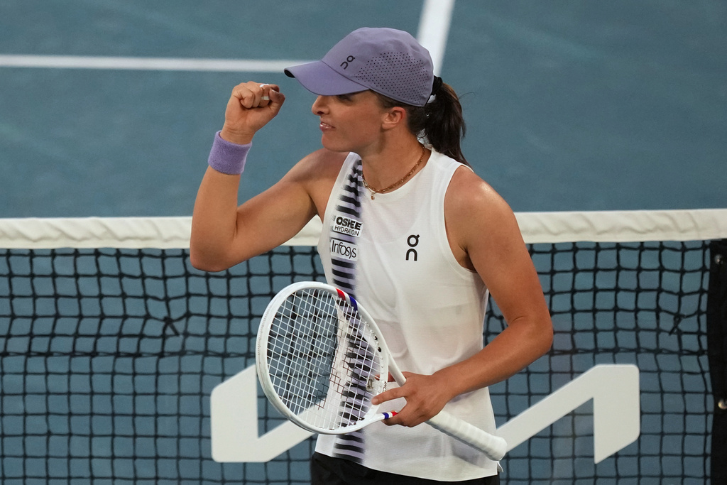 Iga Swiatek of Poland celebrates after defeating Maddison Inglis of Australia in their fourth round match at the Australian Open tennis championship in Melbourne, Australia, Monday, Jan. 26, 2026. (AP Photo/Mark Baker)