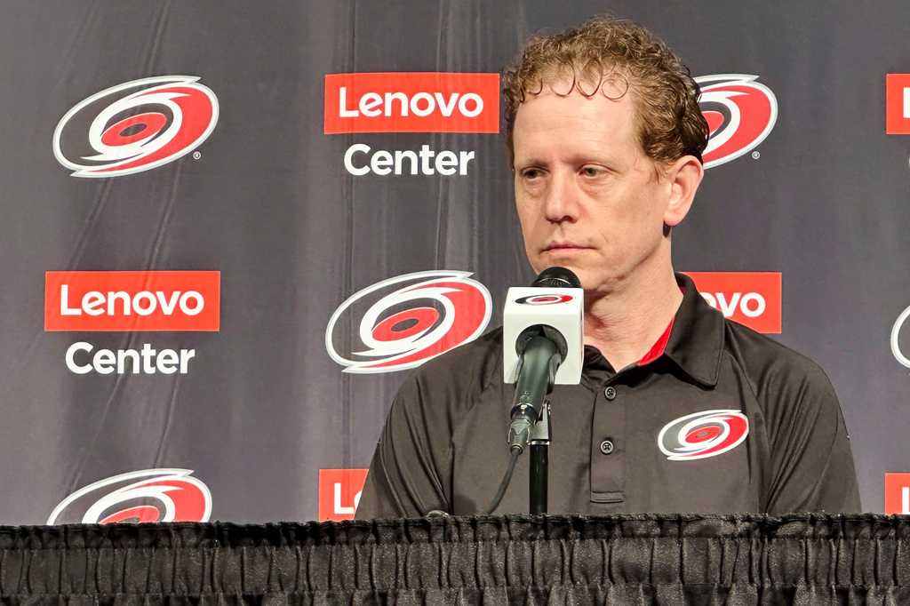 FILE - Carolina Hurricanes general manager Eric Tulsky speaks during an end-of-year NHL hockey news conference, June 3, 2025, in Raleigh, N.C. (AP Photo/Aaron Beard, File)