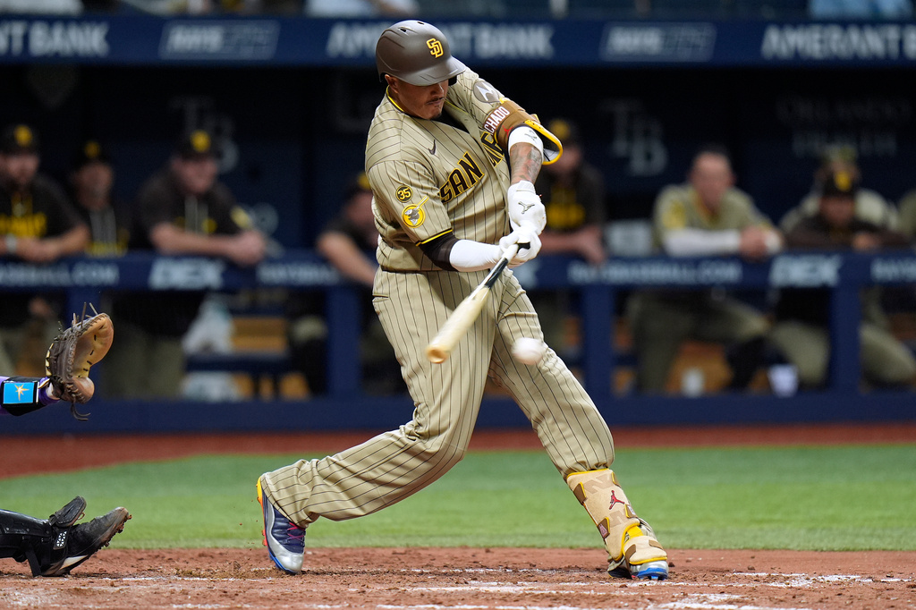 San Diego Padres' Manny Machado connects for a two-run single off Tampa Bay Rays pitcher Kevin Kelly during the seventh inning of a baseball game Saturday, Aug. 29, 2026, in St. Petersburg, Fla. (AP Photo/Chris O'Meara)
