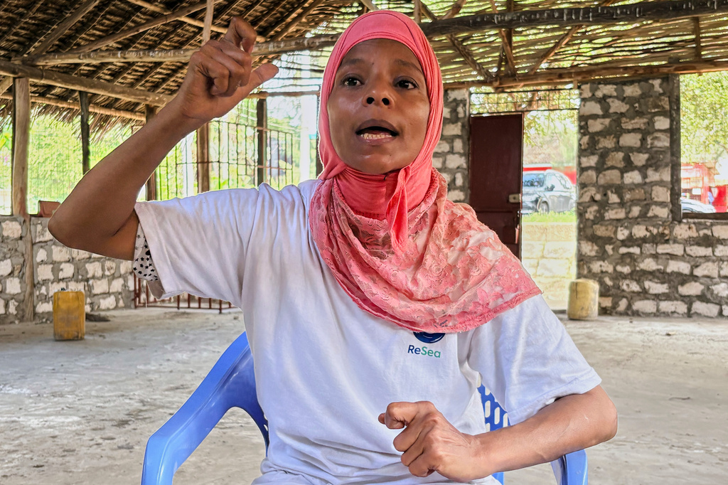 Nuru Mohammed, a fisherwoman speaks inside an unfinished restaurant being built by a women's group of fishmongers in Sabaki, Malindi, Kenya, on June 15, 2026. (AP Photo/Allan Olingo)