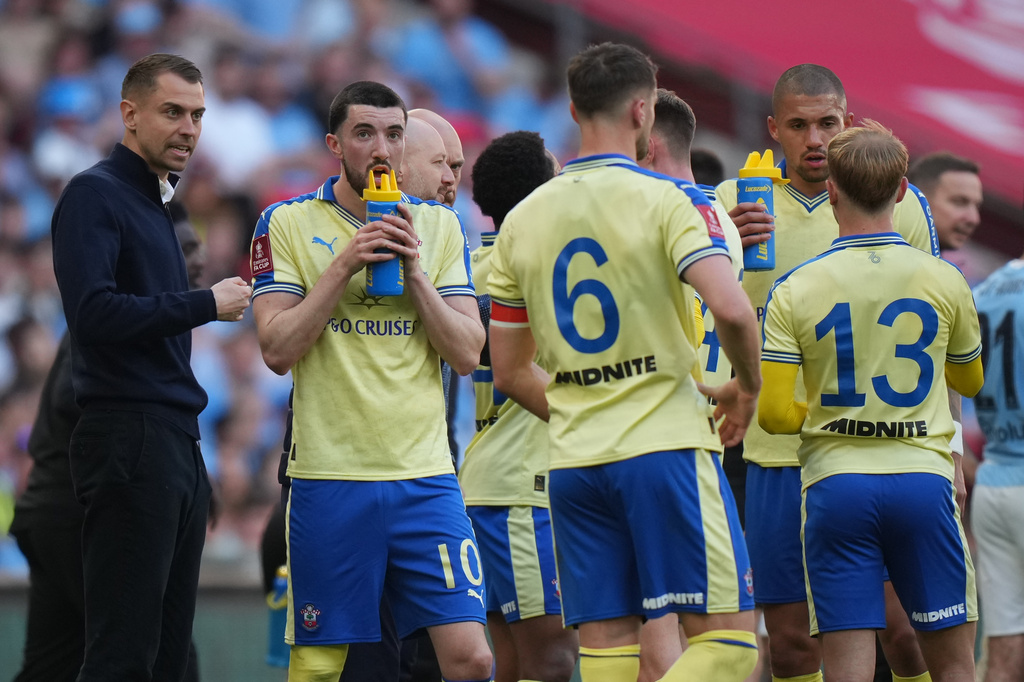 FILE - Southampton's coach Tonda Eckert talks to his players during the FA Cup semifinal soccer match between Manchester City and Southampton in Manchester, England, Saturday, April 25, 2026. (AP Photo/Kin Cheung, File)