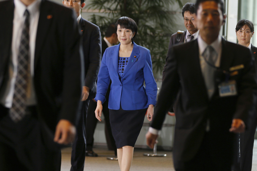 FILE - Japan's Internal Affairs Minister Sanae Takaichi, center, arrives at the prime minister's official residence in Tokyo, Aug. 3, 2016. (AP Photo/Shizuo Kambayashi, File)