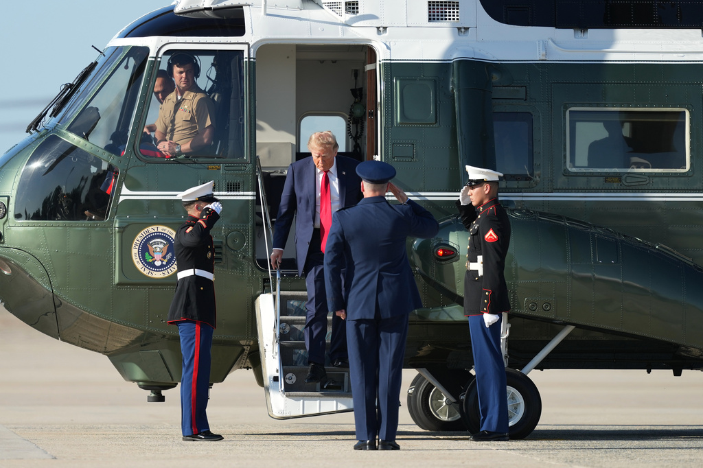 President Donald Trump arrives on Marine One and is saluted by Air Force Col. Christopher M. Robinson, commander of the 89th Airlift Wing, to board Air Force One, Wednesday, Sept. 16, 2026, at Joint Base Andrews, Md. (AP Photo/Alex Brandon)