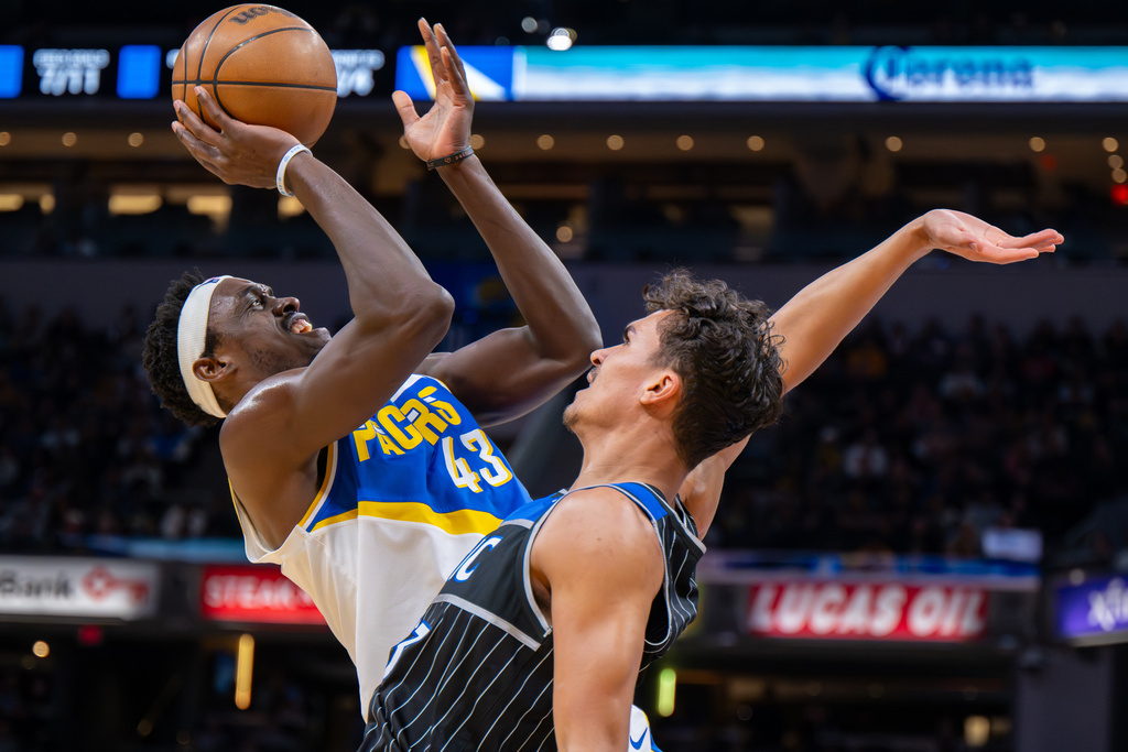 Indiana Pacers forward Pascal Siakam (43) shoots while being defended by Orlando Magic forward Tristan da Silva (23) during the first half of an NBA basketball game in Indianapolis, Wednesday, Dec. 31, 2025. (AP Photo/Doug McSchooler)