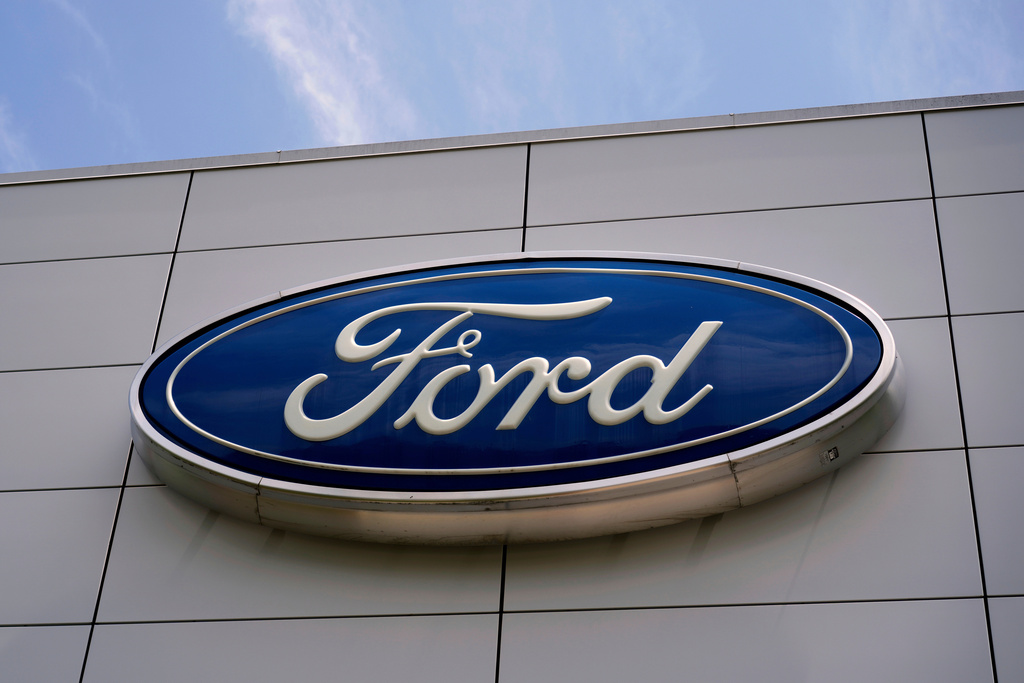 FILE - The Ford logo is seen above the entrance to the Ford Motor Company Kentucky Truck Plant, Wednesday, April 30, 2025, in Louisville, Ky. (AP Photo/Carolyn Kaster, File)